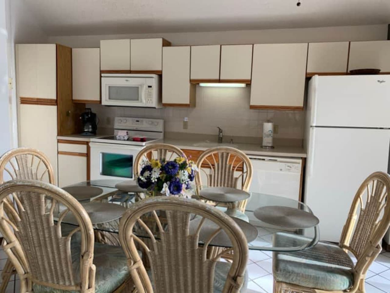 "Gather around the dining table for memorable meals and laughter. This kitchen and dining space has everything you need!"