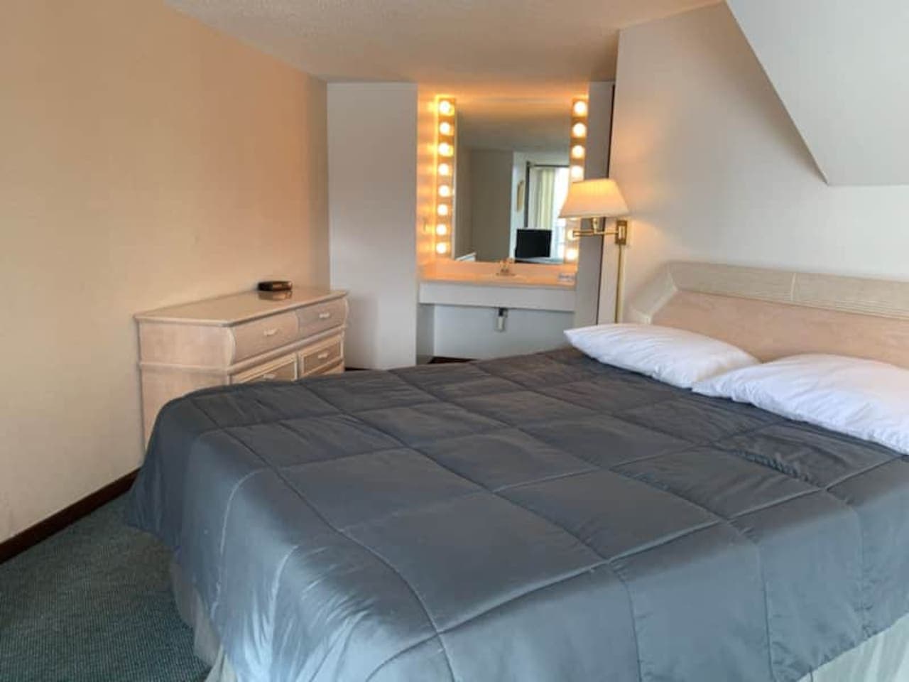Comfort meets convenience in this well-appointed bedroom two, featuring a bright vanity area for getting ready for your day on the lake.