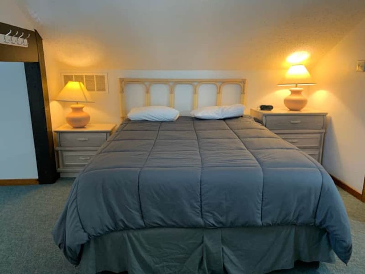 A peaceful retreat awaits in this charming bedroom three, complete with comfortable lighting for ultimate relaxation.