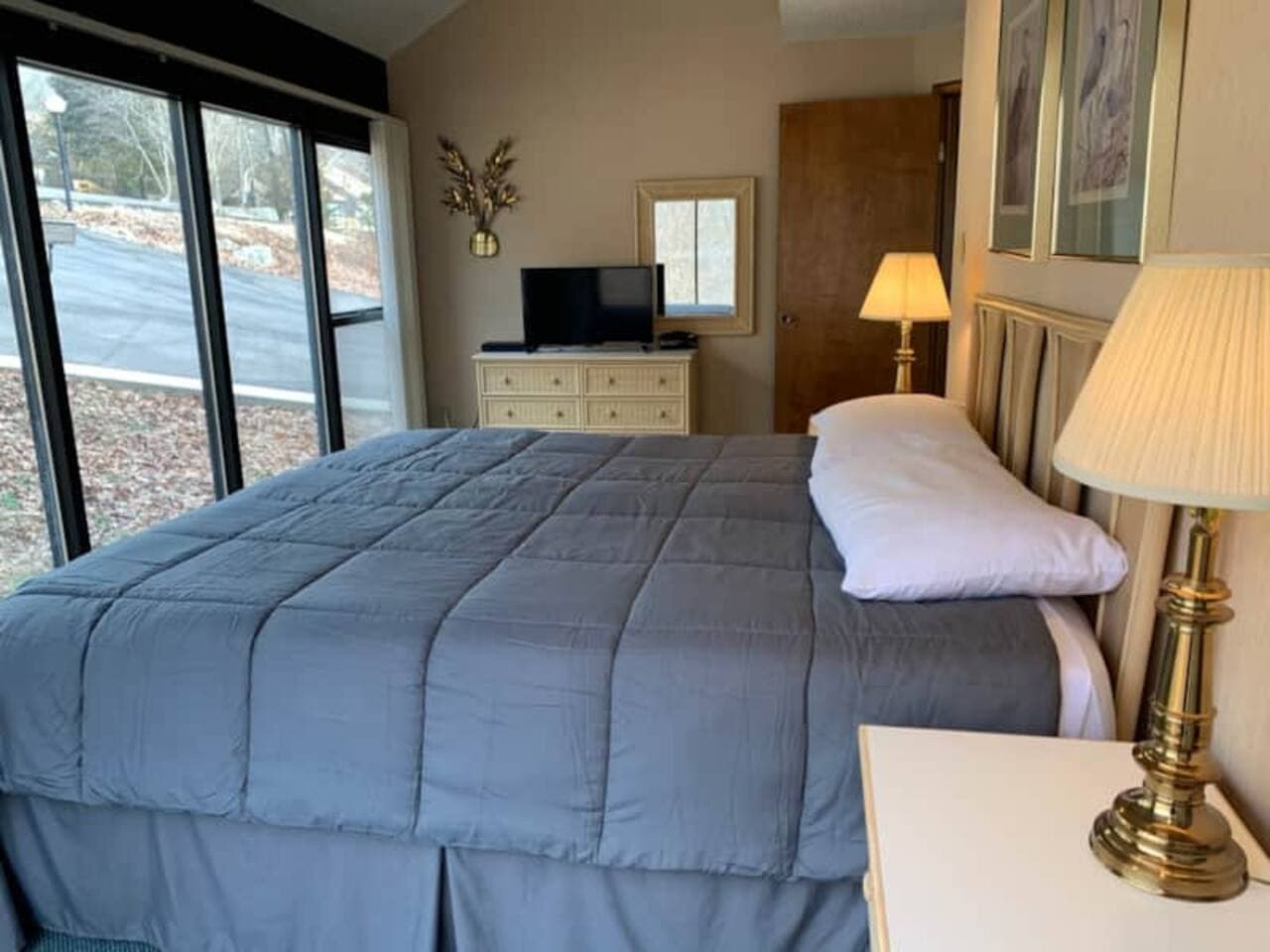 Another comfortable space to unwind! This bedroom offers bright windows and everything you need for a restful stay.