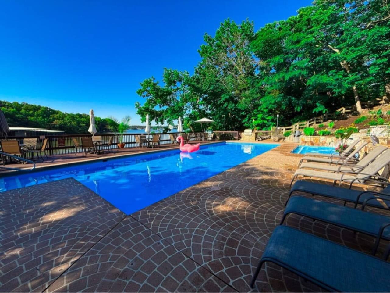Bask in the sunshine with friends and family. Relax by the pool, where comfortable loungers invite you to unwind while enjoying a smooth, effortless connection to the stunning lakefront.