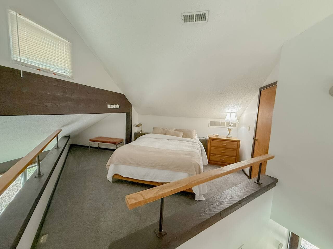 Step into a one-of-a-kind bedroom retreat, where comfort meets creativity in an irregularly shaped layout designed for ultimate relaxation.
