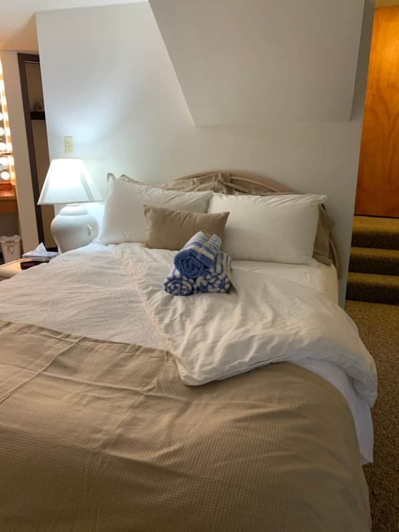 "Drift off to sleep in this comfortable and serene bedroom one. Fresh towels ready for your arrival!"