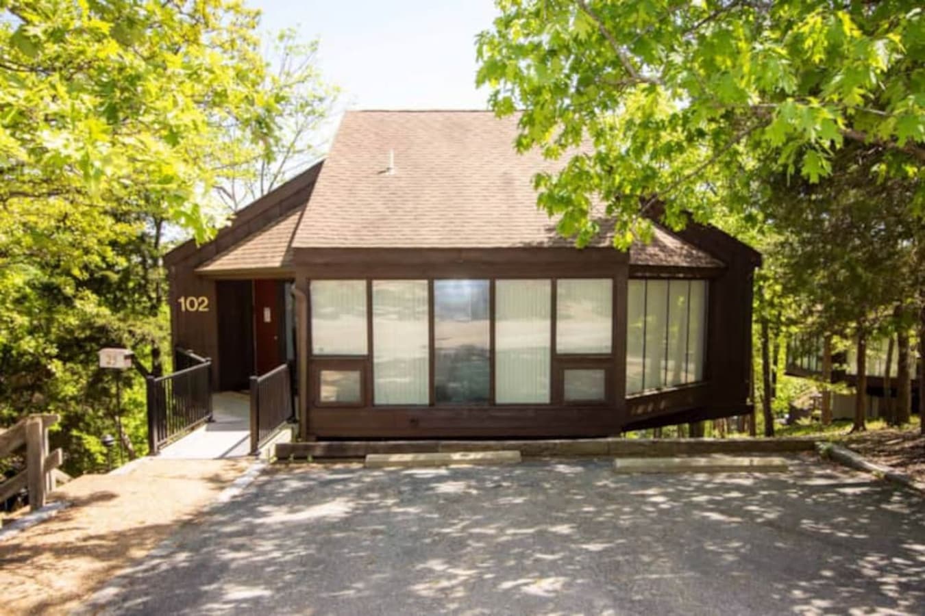 "Experience the peaceful ambiance of the Ozarks from Treeloft Villa 102, offering a perfect blend of comfort and natural beauty."