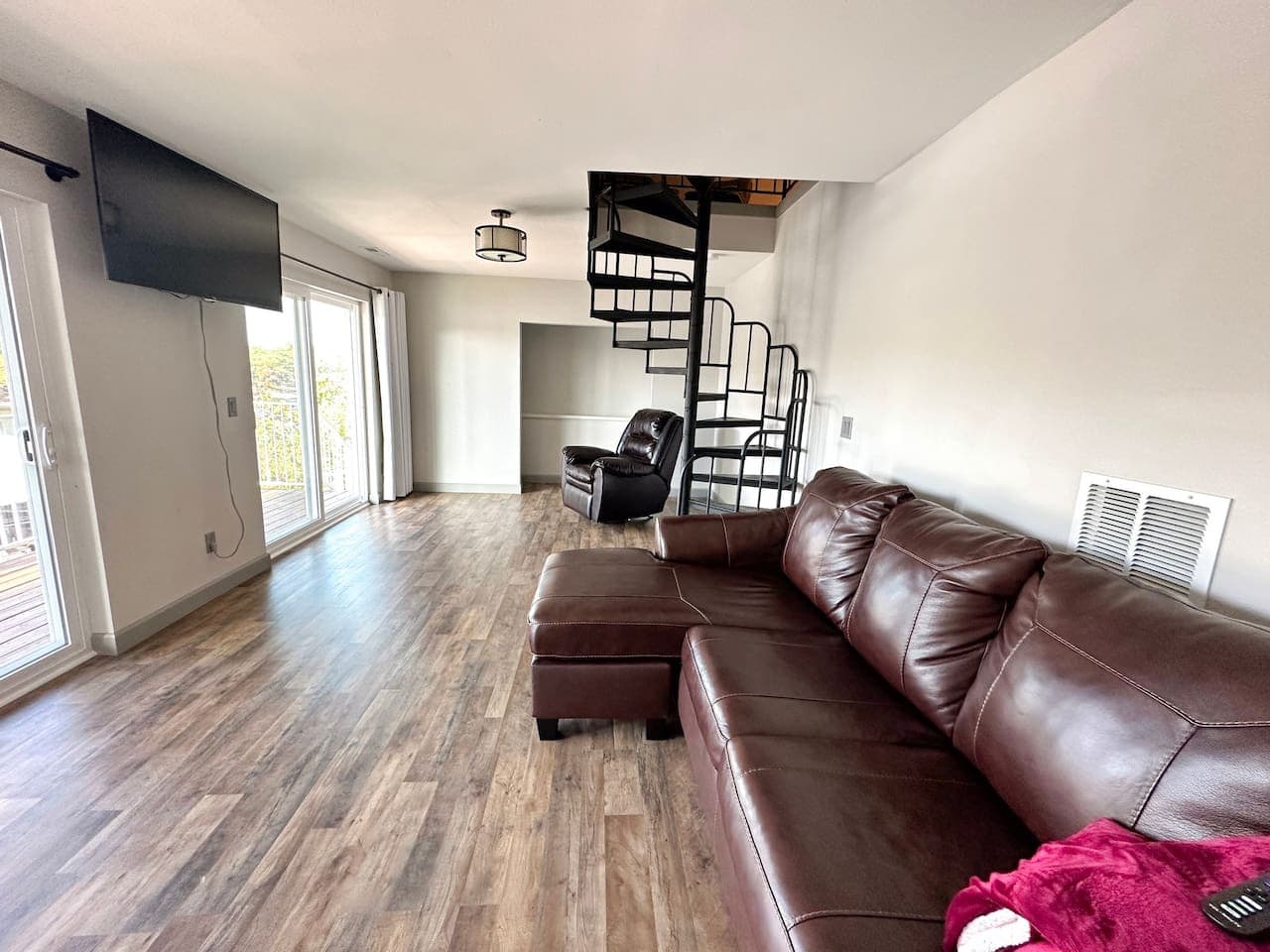 Spacious and inviting living room with an open layout, perfect for relaxing or entertaining. Enjoy a seamless flow of natural light and ample room to unwind in style.