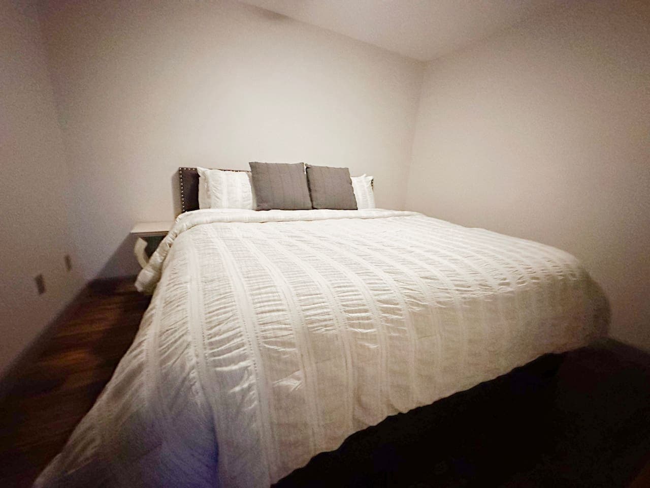 Cozy and inviting, the second bedroom offers a peaceful retreat with plush bedding and thoughtful touches. Ideal for guests or family members to unwind in comfort.