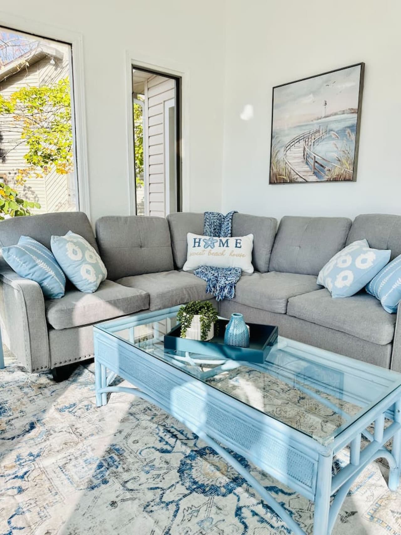 Comfortable living room with plenty of seating and natural light by the lake.