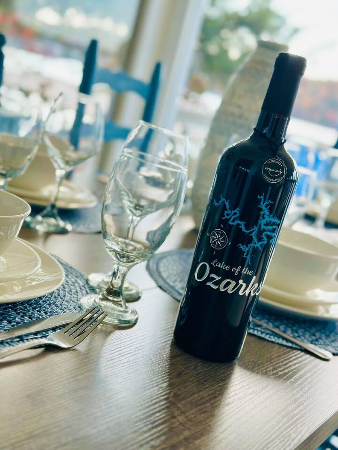 Cheers to unforgettable memories at Hickory Haven! Whether it's a special occasion or just a cozy evening, our beautifully set dining area, complete with a nod to the Lake of the Ozarks, is ready for your gathering.