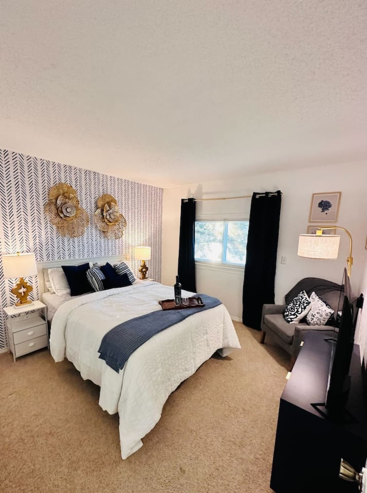Unwind in this beautifully appointed bedroom, designed for ultimate comfort and relaxation.