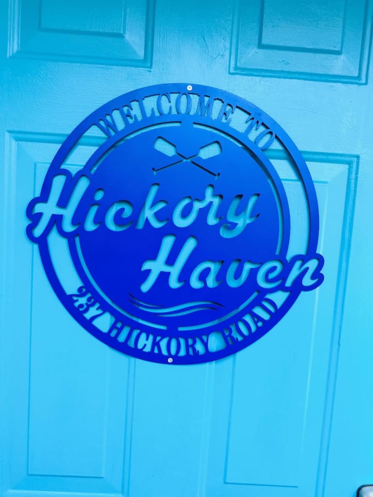 Look for our distinct blue door and custom sign.  A unique landmark for your one-of-a-kind lakefront experience.