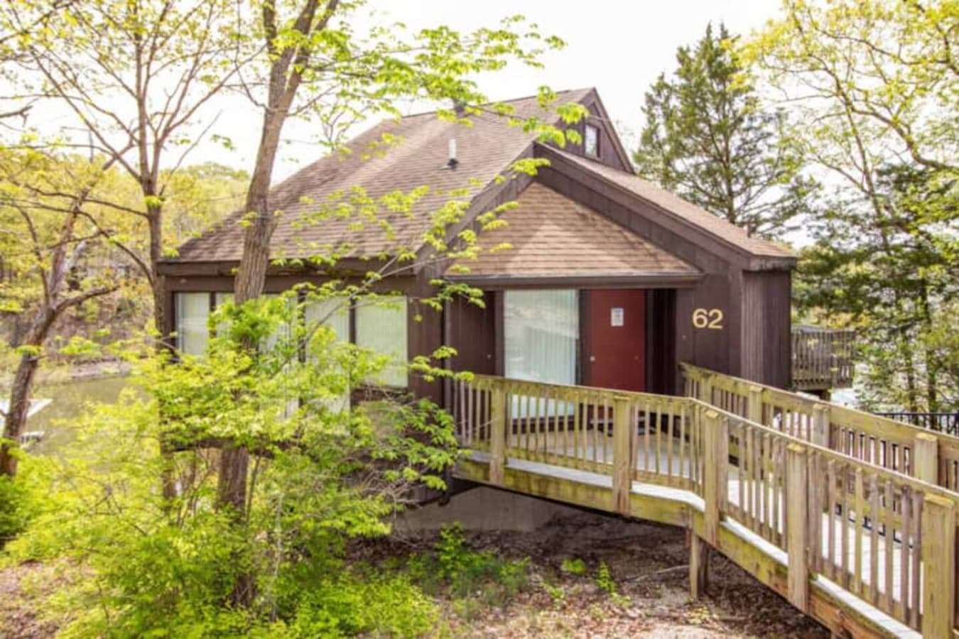 A warm welcome awaits—private path to your hillside hideaway in Treetop Village.
