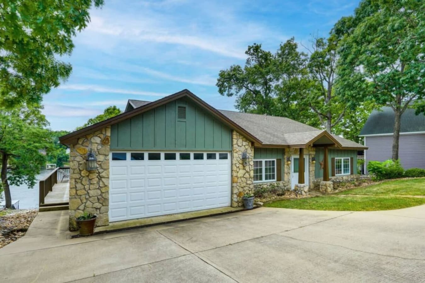 A picturesque view of the front elevation with a spacious driveway.