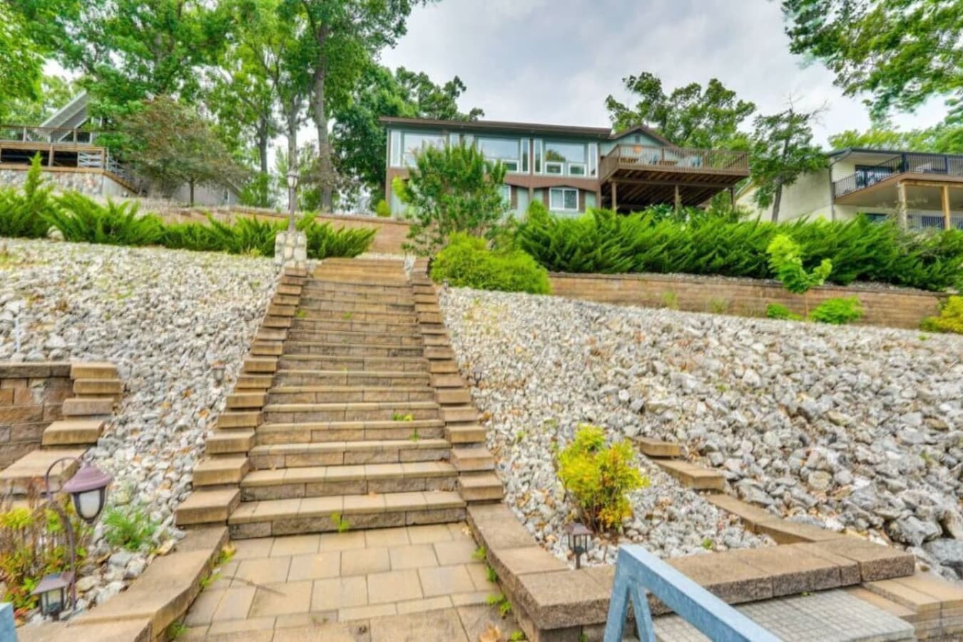A beautifully landscaped stairway leading to the entrance of the home.