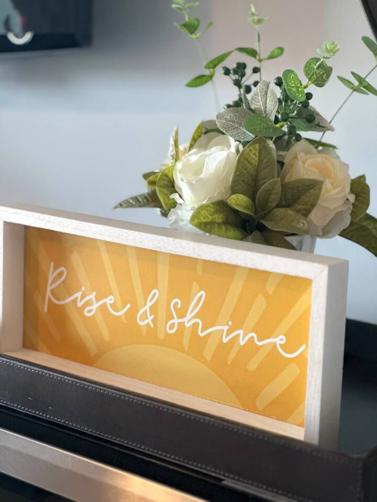 Charming touches like this 'Rise & Shine' sign set the tone for cheerful, restful mornings at the lake.