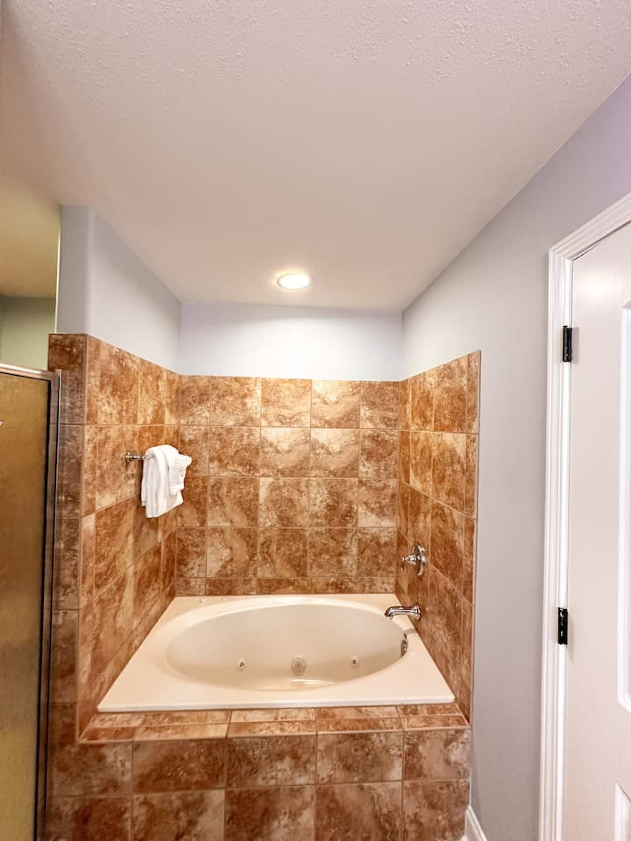 Your ensuite bath features a deep soaking tub and spacious layout—ideal for relaxing in style.