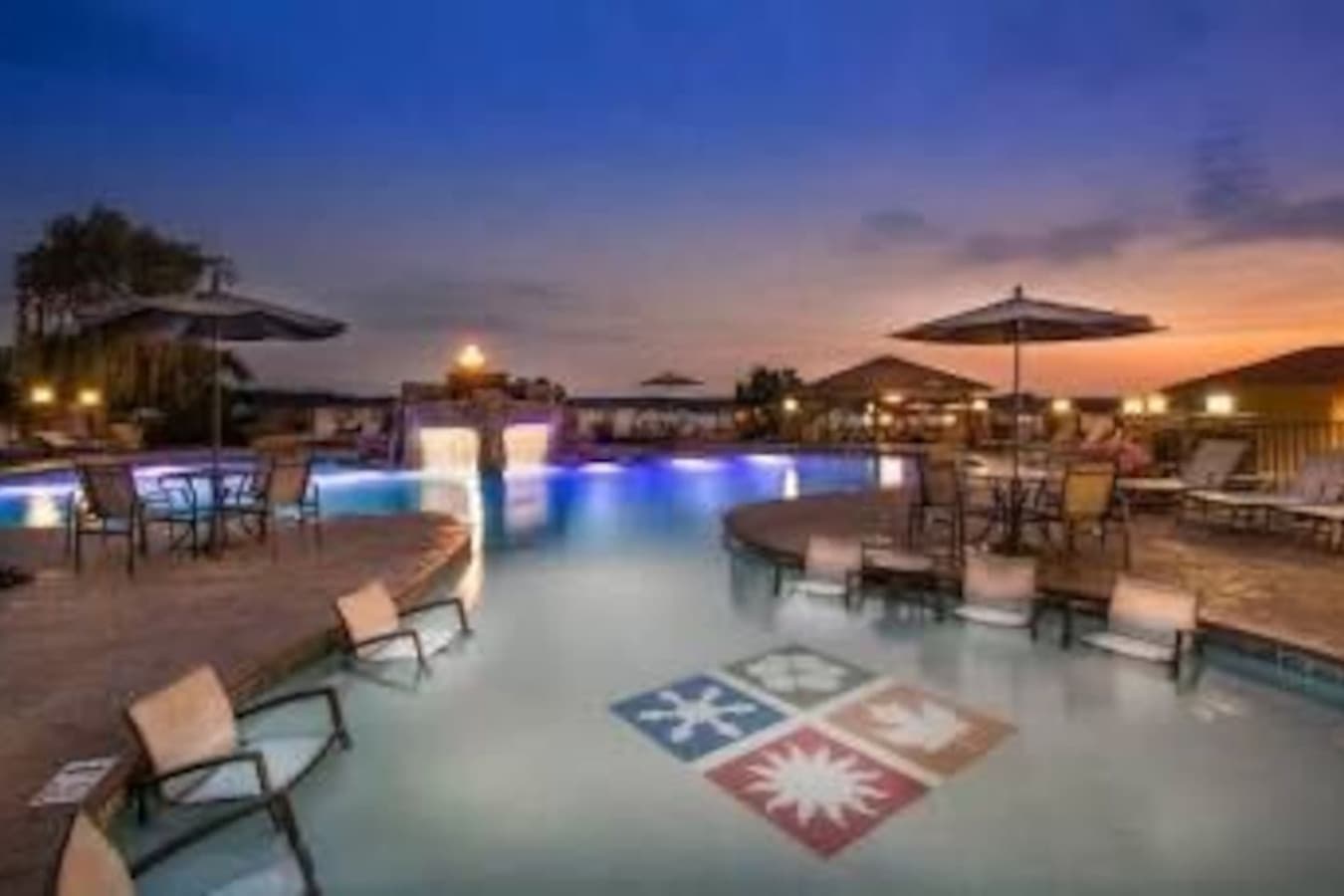 "Unwind poolside as the sun sets over the lake—this is lakeside luxury at its most peaceful."