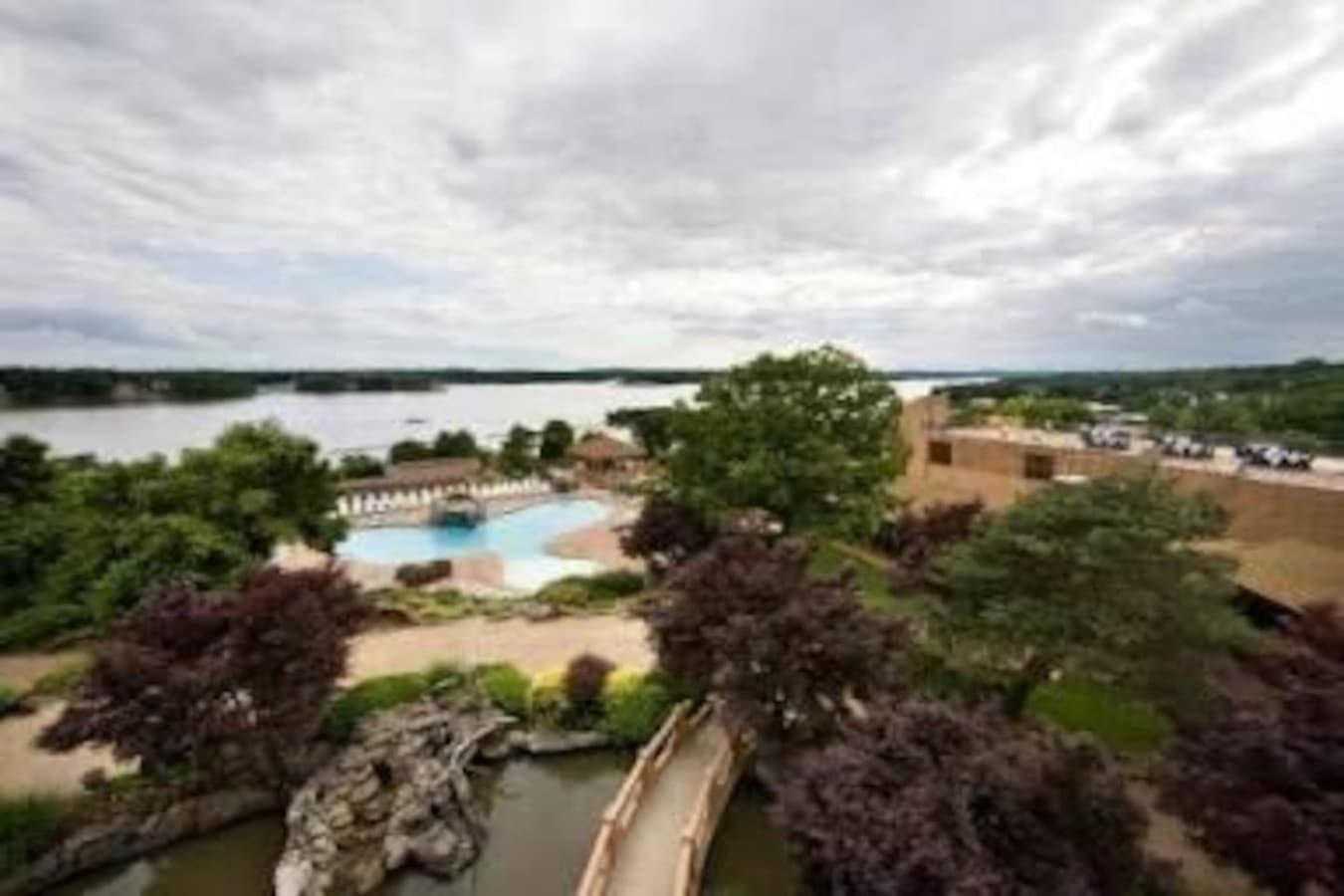 "Breathtaking views of the lake, gardens, and resort amenities from above—your private oasis awaits."