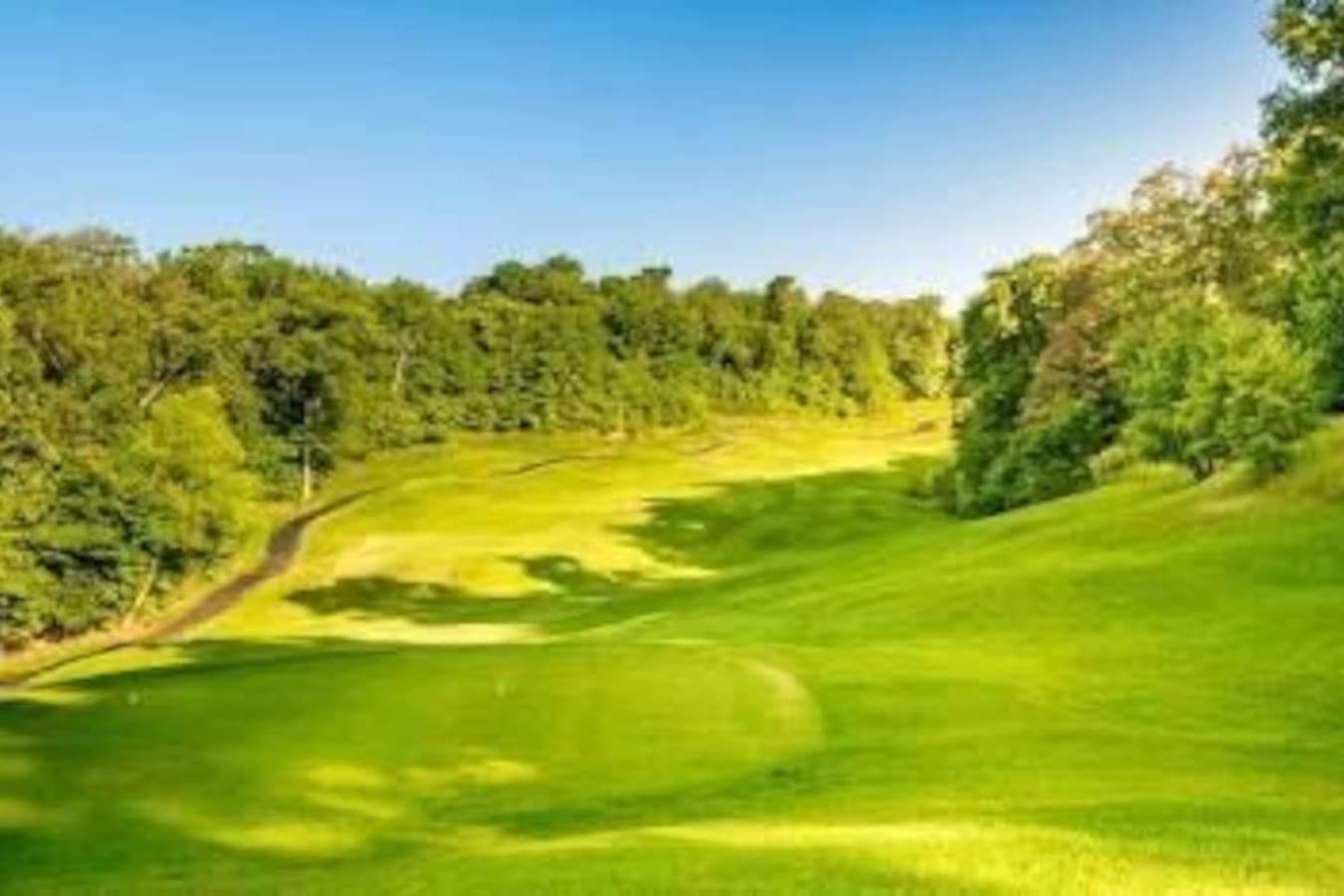 "Endless greenery and beautifully maintained grounds offer a serene setting for golfers and nature lovers alike."