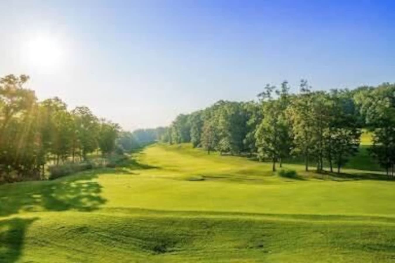 "Early mornings are magical on this lush, sunlit course—perfect for golfers who love a peaceful start."