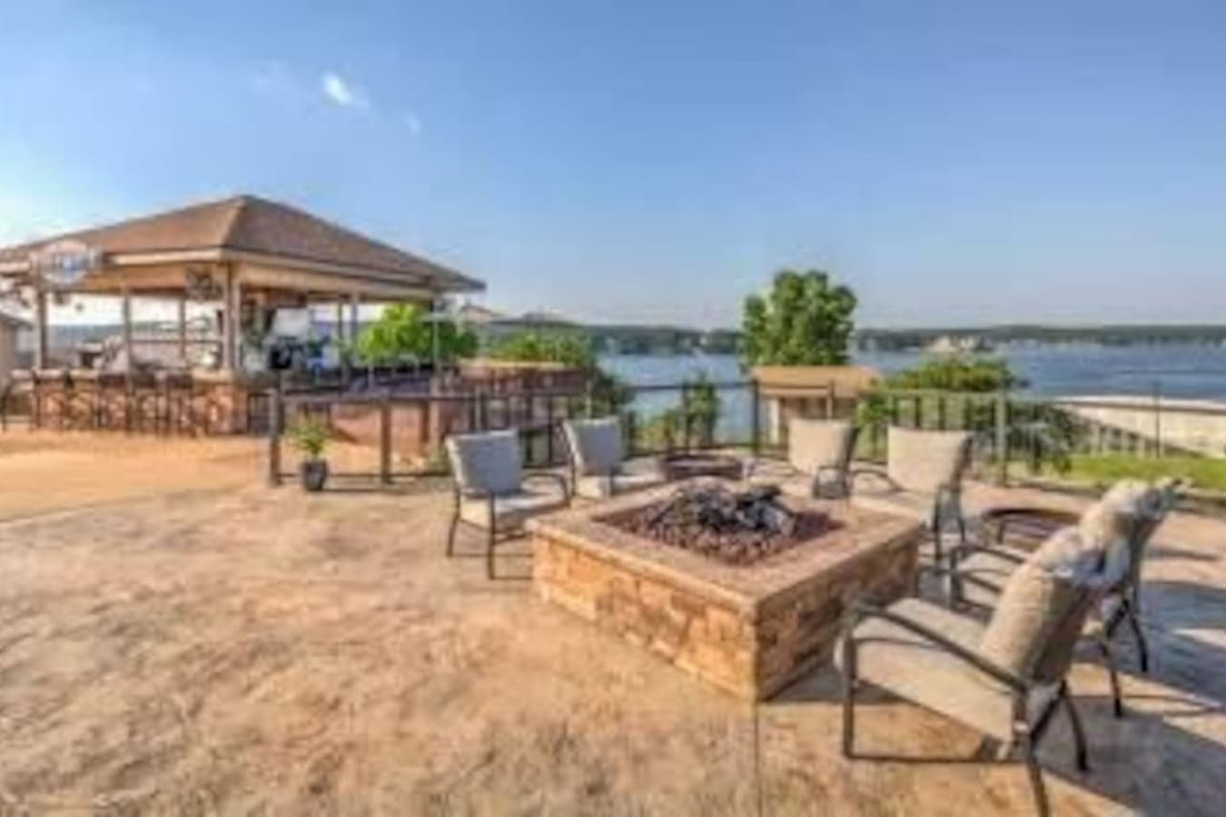 "Take in the stunning lake views while relaxing around the outdoor fire pit—ideal for morning coffee or evening s'mores."