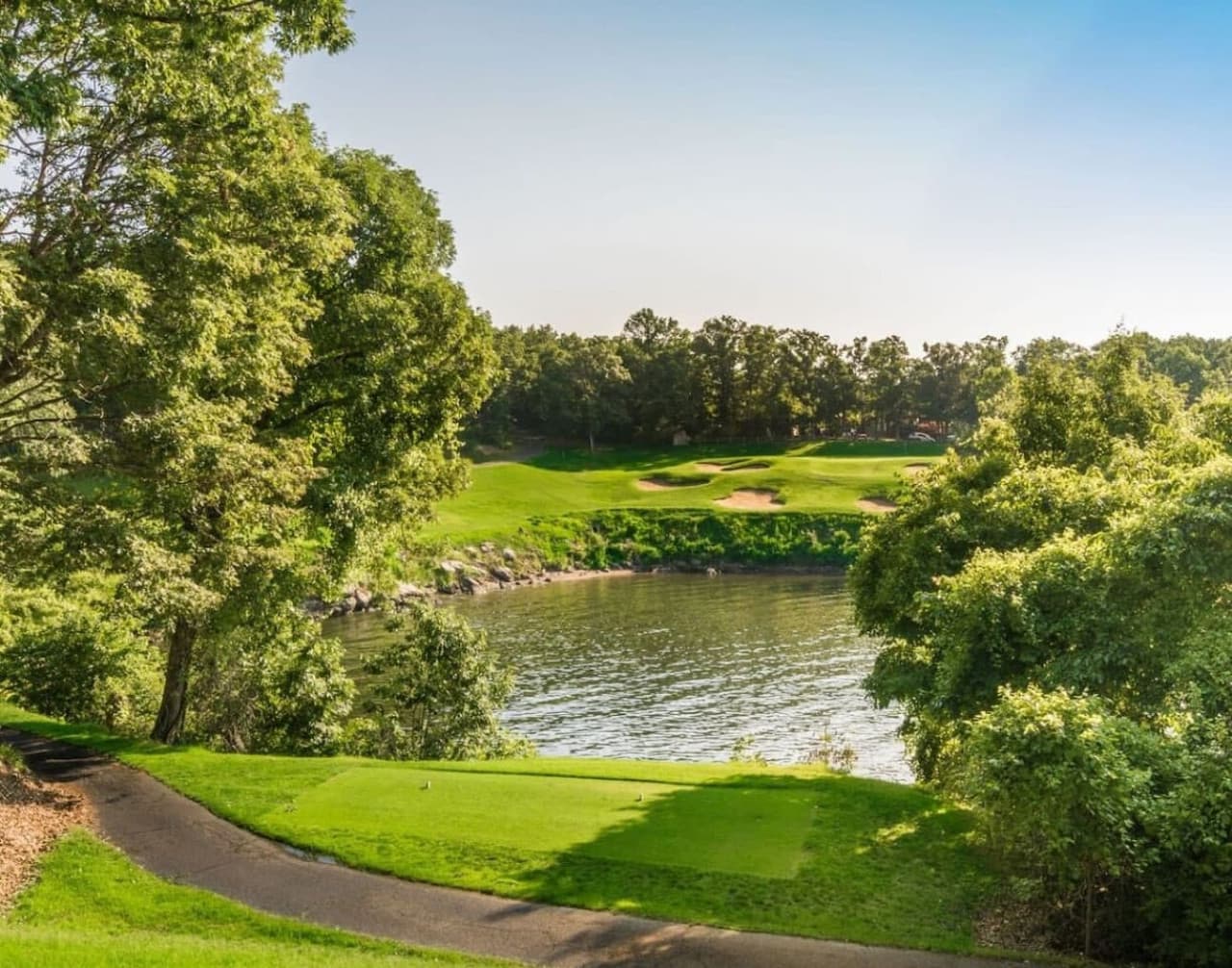"This unforgettable hole pairs perfectly manicured greens with breathtaking lake views—golfing at its finest."
