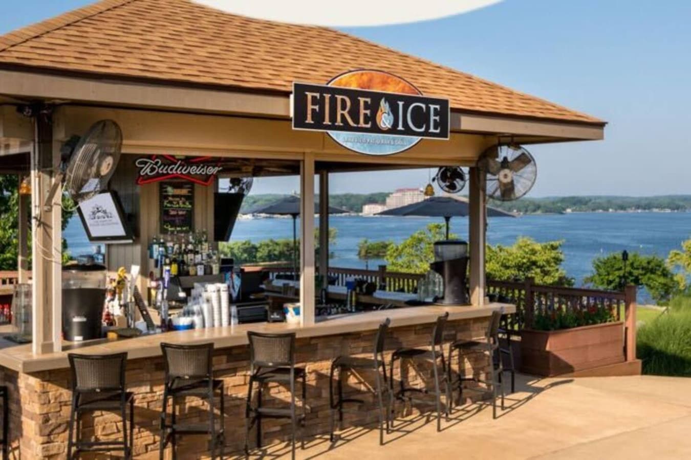 "Grab a drink at the Fire & Ice bar with sweeping lake views—because resort life should always feel this good."