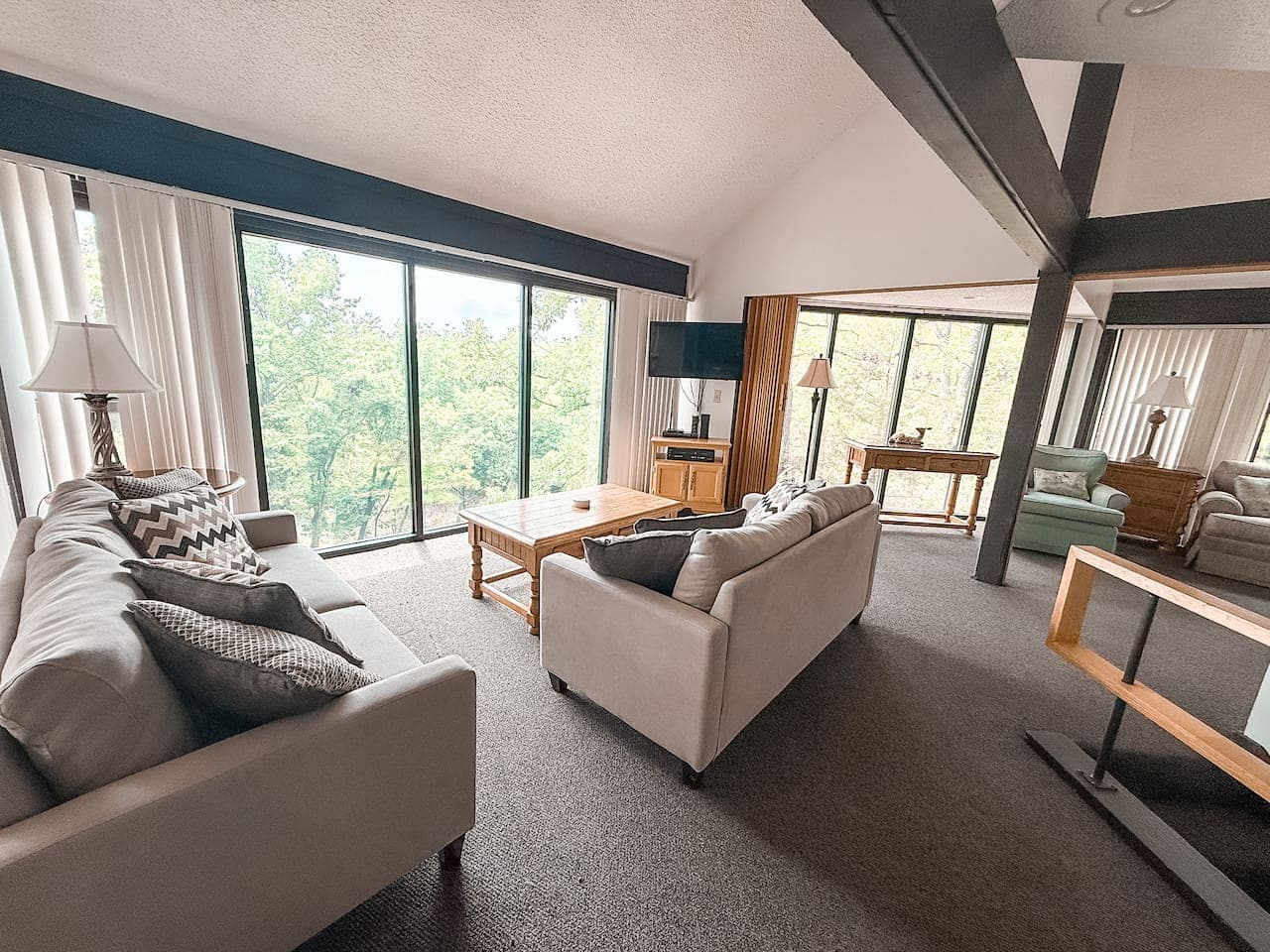 An inviting space features cozy sofas and ample seating for friends and loved ones. Whether unwinding or making memories, this bright and open living area ensures comfort and connection.