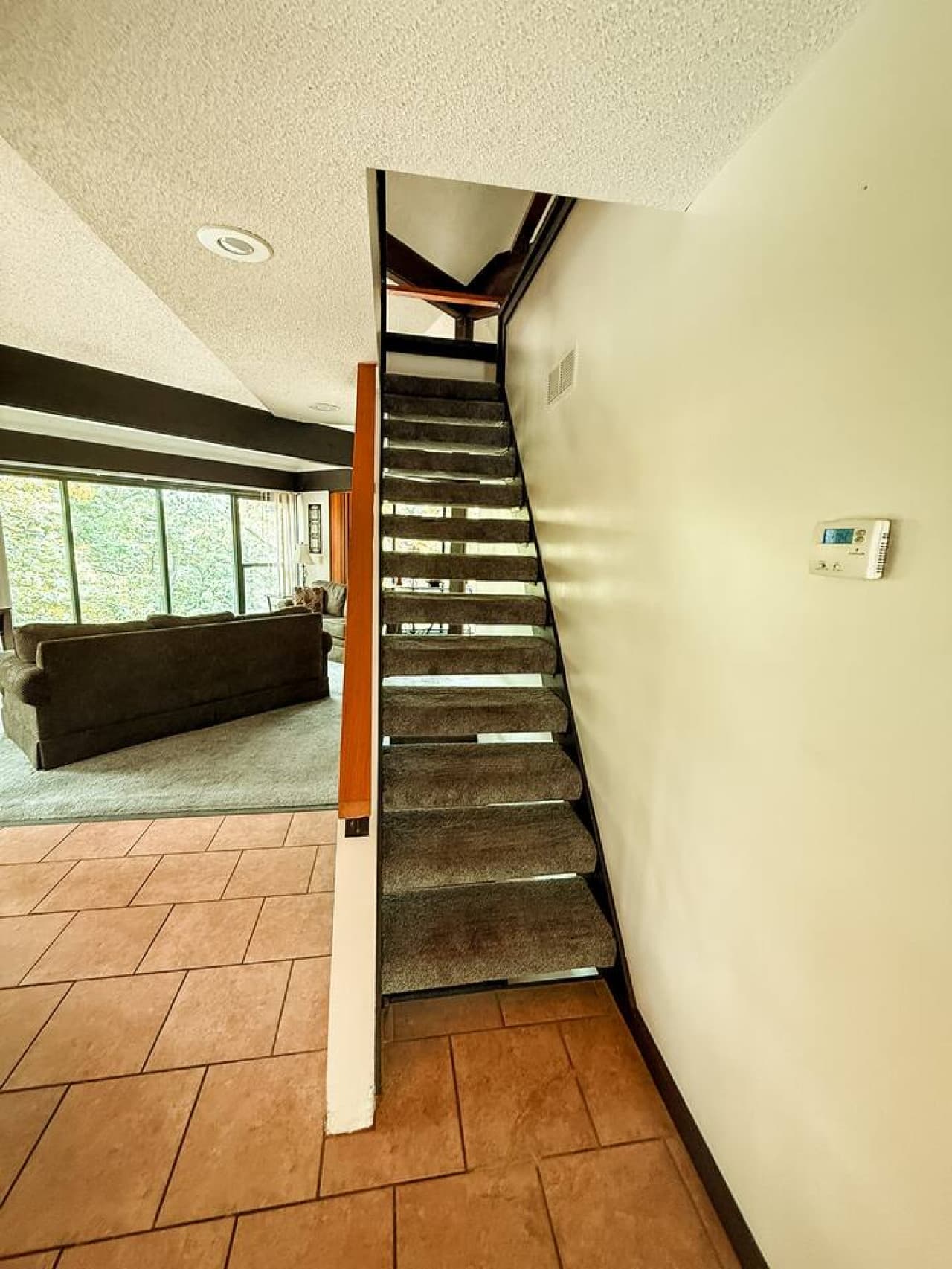 "Welcome inside! This inviting entrance leads you directly into the cozy living space of your Treetop Village getaway."