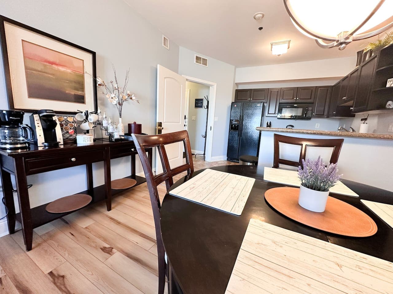 This bright and open living area seamlessly connects to a spacious dining space, making it ideal for entertaining. Enjoy relaxing evenings by the fireplace or step out onto the private balcony for fresh air and views.