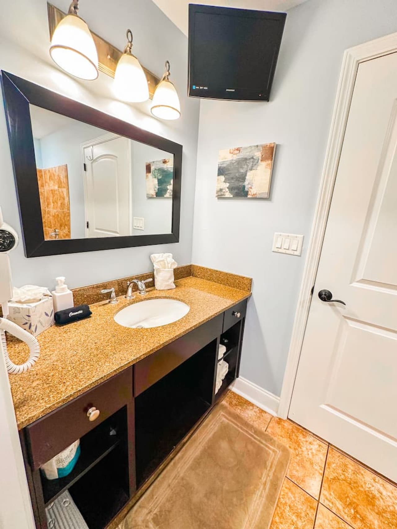 A clean and well-lit bathroom designed for convenience, with fresh linens, toiletries, and everything you need for a comfortable stay.