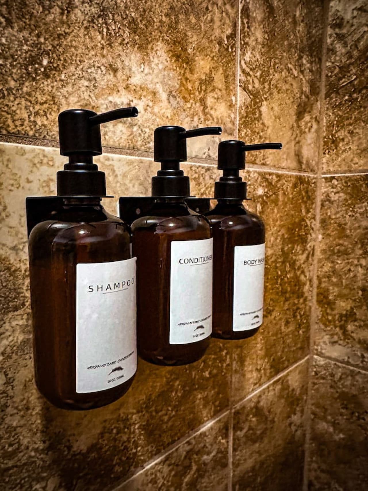 Featuring a modern vanity, plush towels, and essential amenities, this bathroom is designed for comfort and convenience.