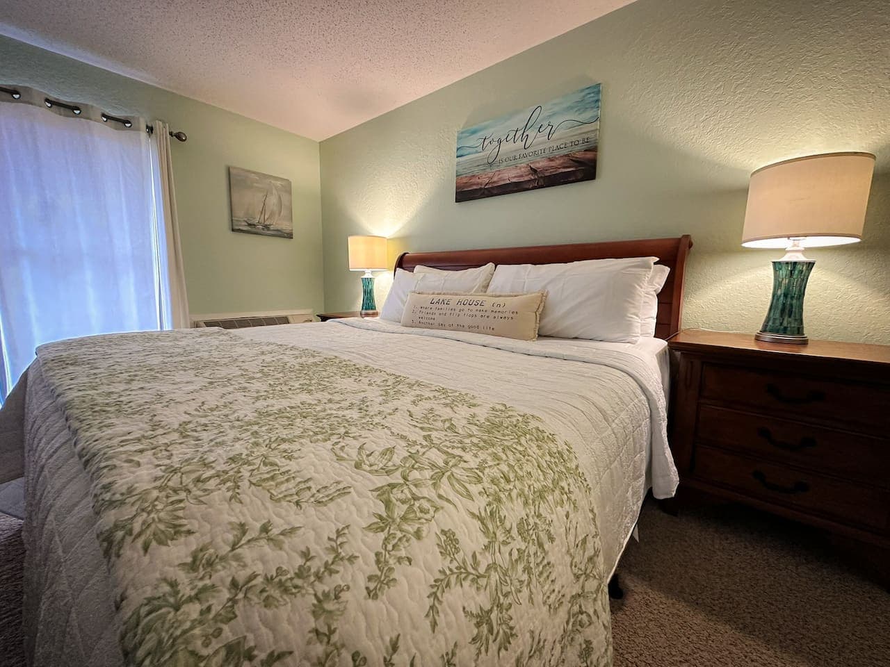 Relax in the tranquil master king suite, featuring cozy bedding and serene decor for ultimate comfort.