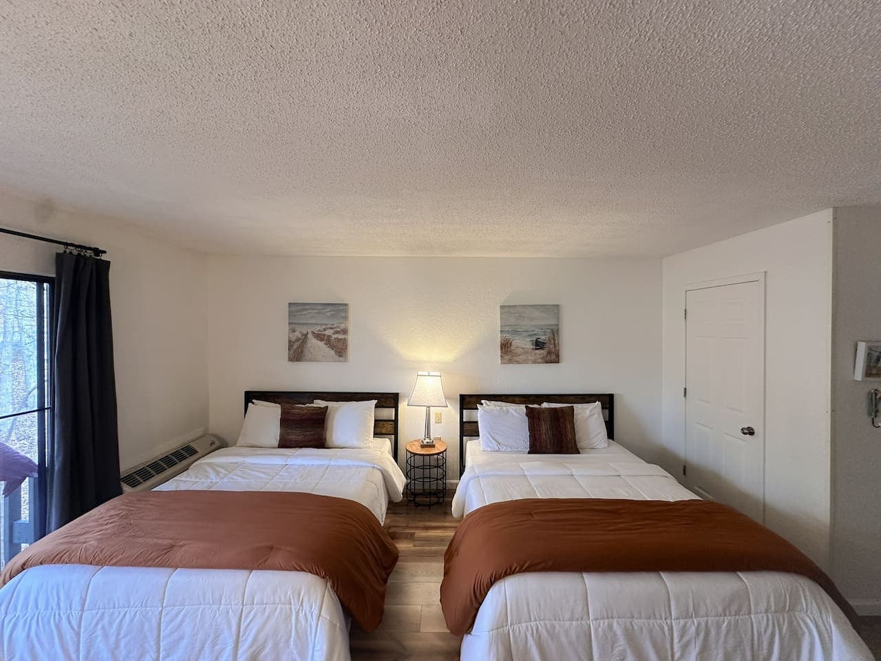 Comfort and style come together in this two cozy queen bed, ideal for families or friends traveling together.