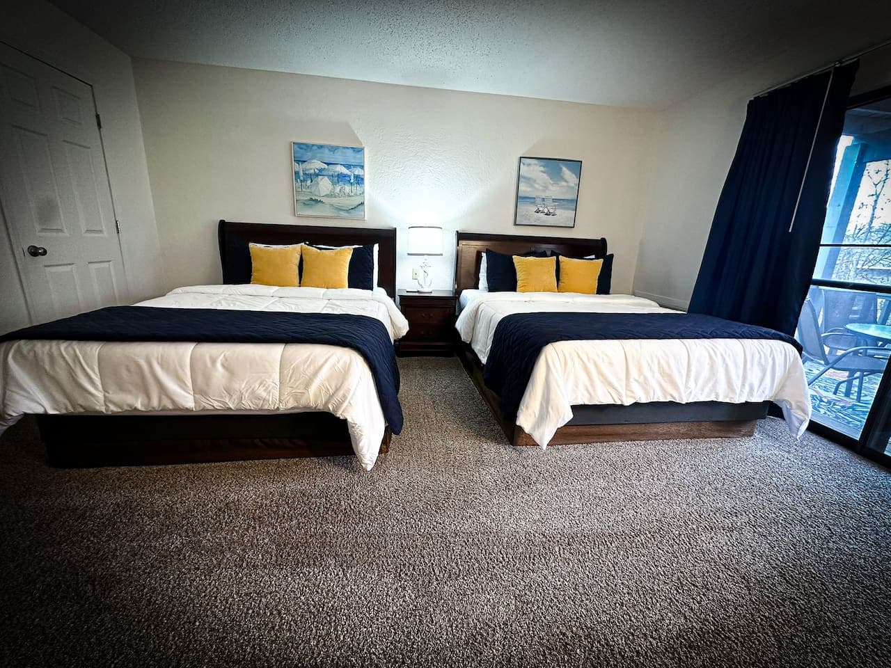Charming and comfortable, this bedroom features two queen beds for ultimate relaxation.