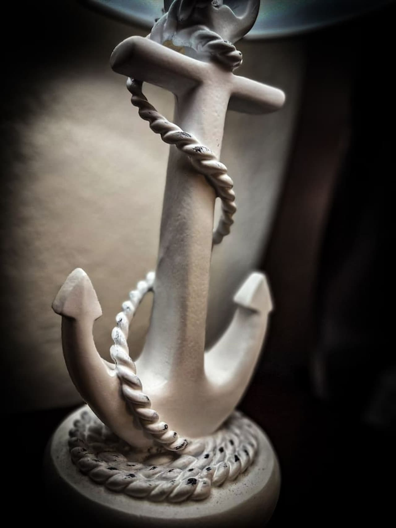 "Nautical details like this anchor lamp bring coastal charm to your getaway.