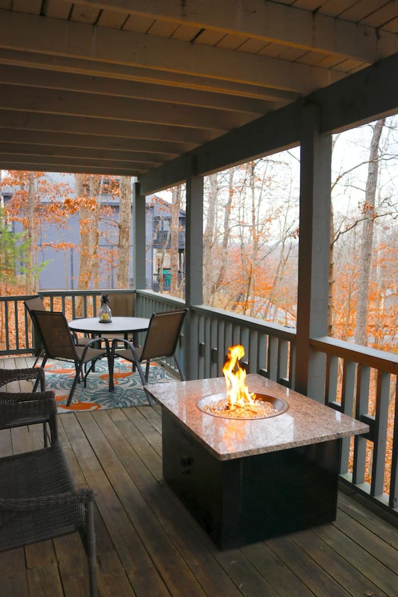 Cozy up by the fire pit and enjoy the peaceful ambiance of the surrounding woods.