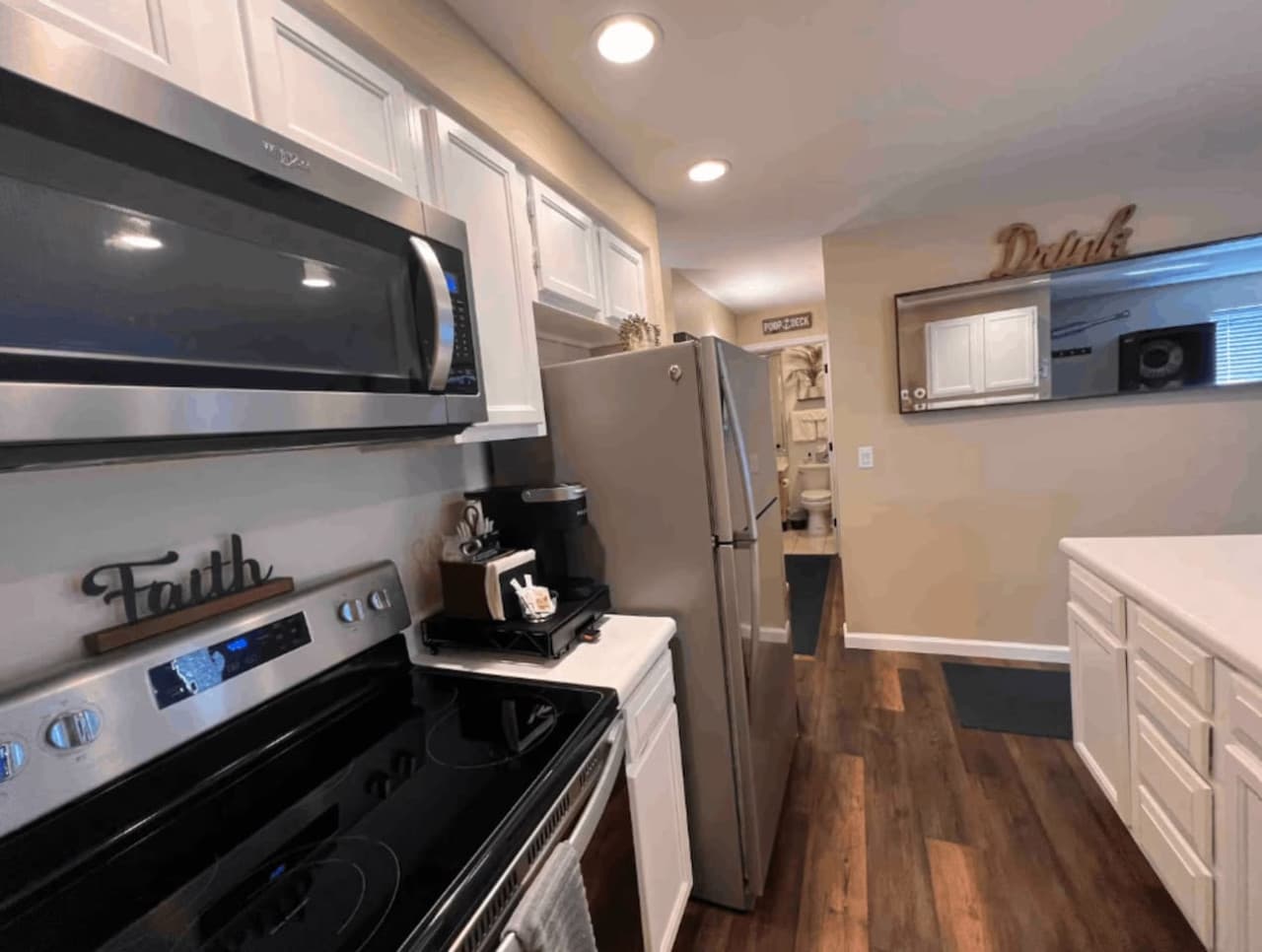 Bright, fully equipped kitchen with a modern stove and plenty of counter space for meal prep.