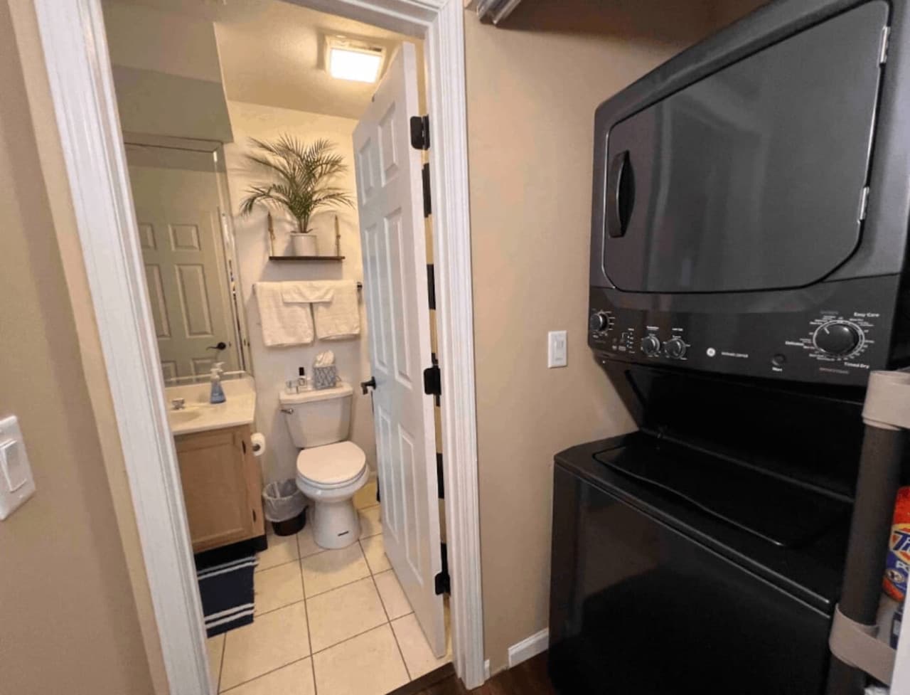 This unit features a convenient in-unit stacked washer and dryer, along with a well-appointed second bathroom that includes a vanity and toilet.