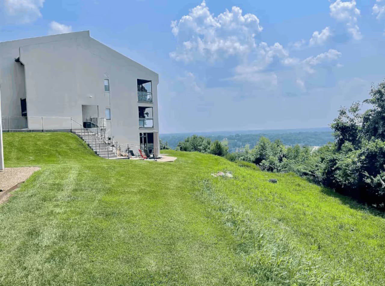 Relax and enjoy breathtaking, panoramic views of the Lake of the Ozarks from this hillside studio, a truly serene setting for your getaway.