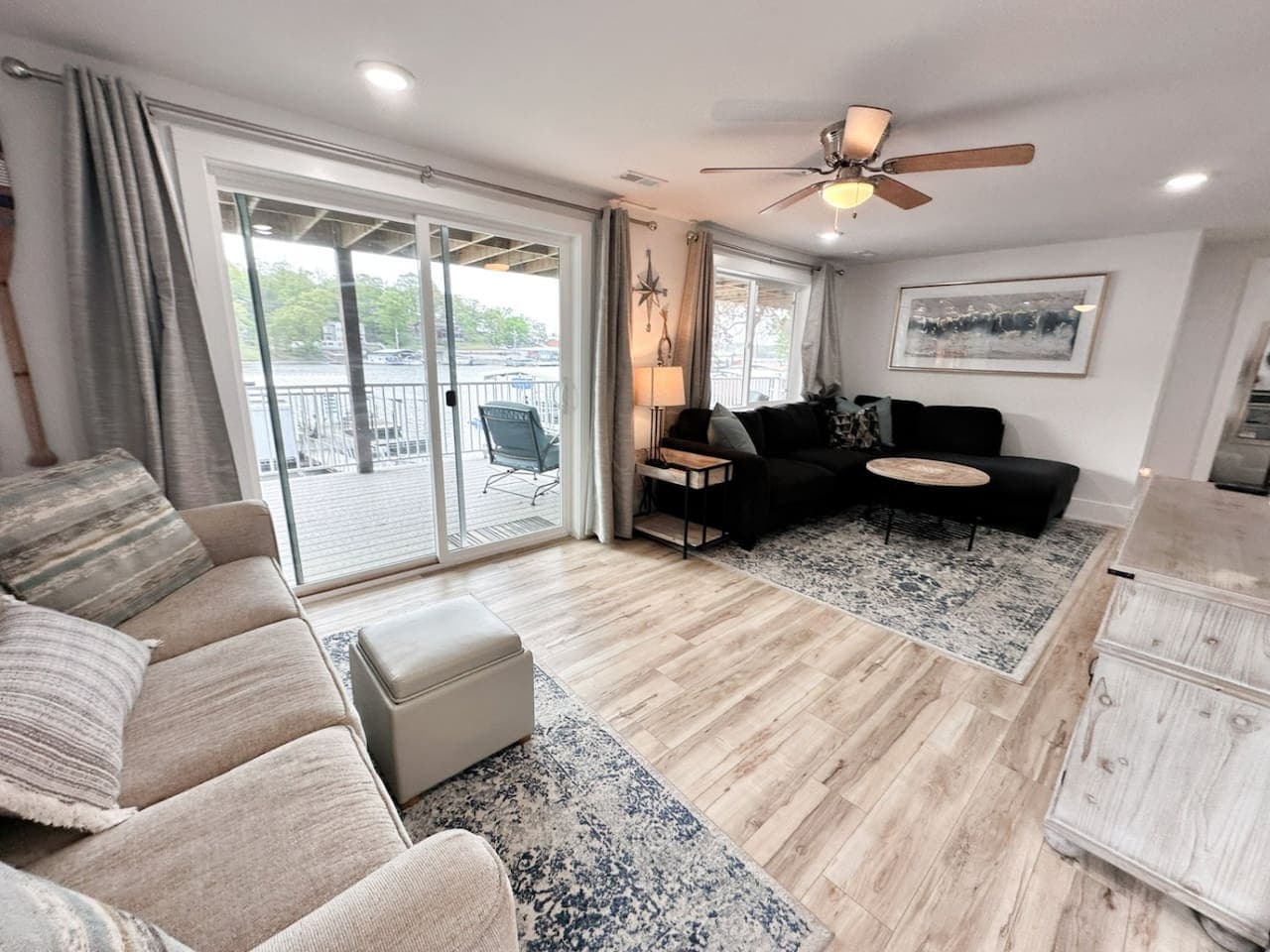 Lakefront living area with access to lower level deck.