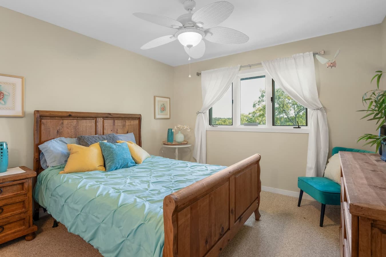 "Drift off to peaceful sleep in this charming bedroom, designed for ultimate comfort and relaxation after a day on the lake."