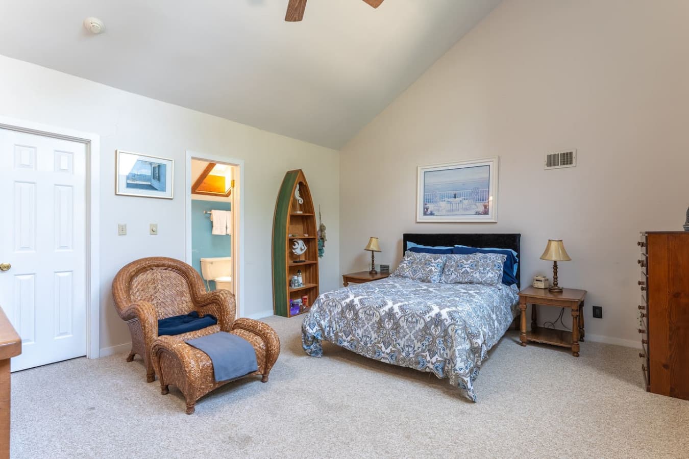 "Welcome to your tranquil loft bedroom, featuring vaulted ceilings and a cozy reading nook – a perfect escape within your escape!"