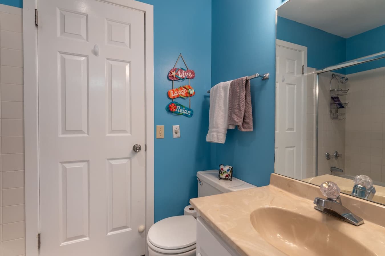"Bright and cheerful, this bathroom is ready for you to refresh and get ready for another exciting day at the lake!"