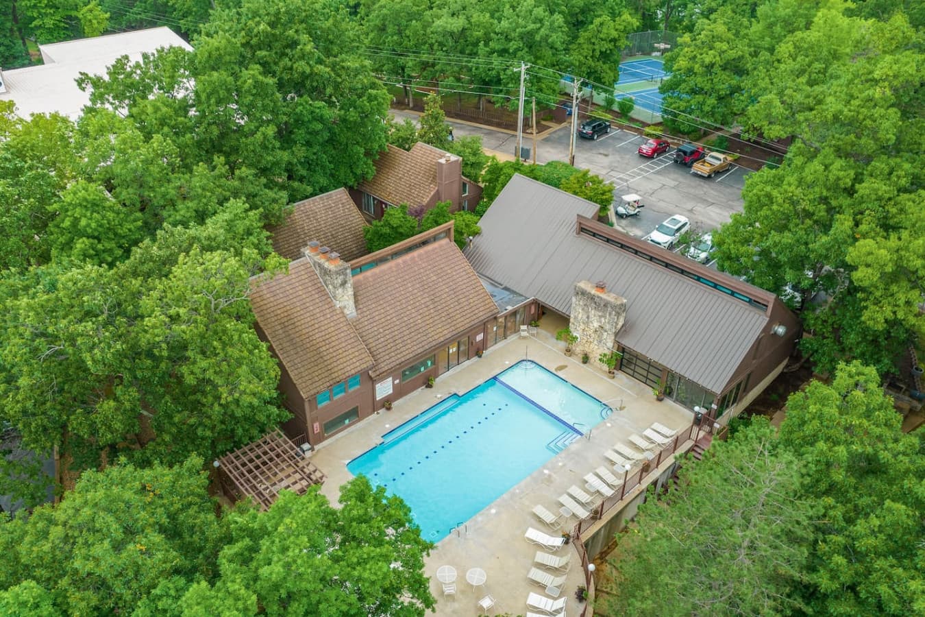 "An aerial view showcasing the fantastic amenities at The Knolls Resort, including the sparkling pool and lush surroundings, ready for you to enjoy!"