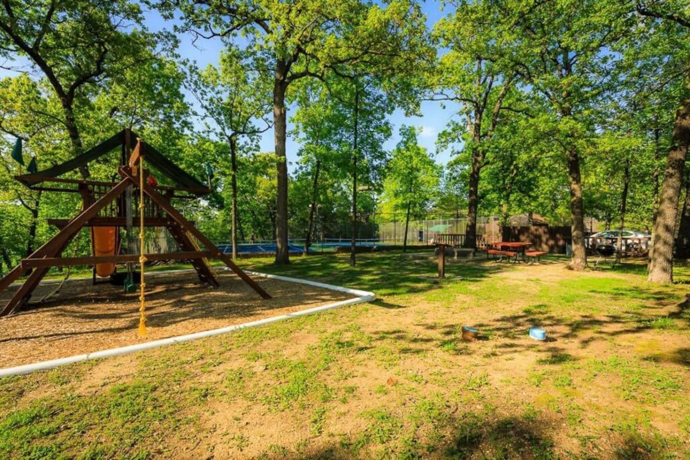 A charming playground surrounded by nature for families with kids.