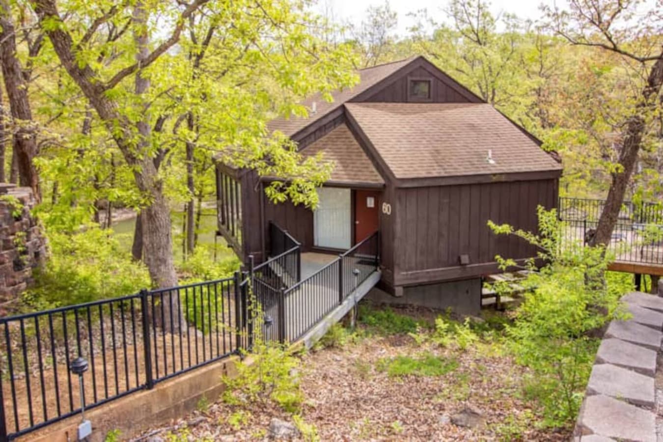 Step into your treehouse-style getaway—Unit 60 combines rustic charm with lakeside convenience.