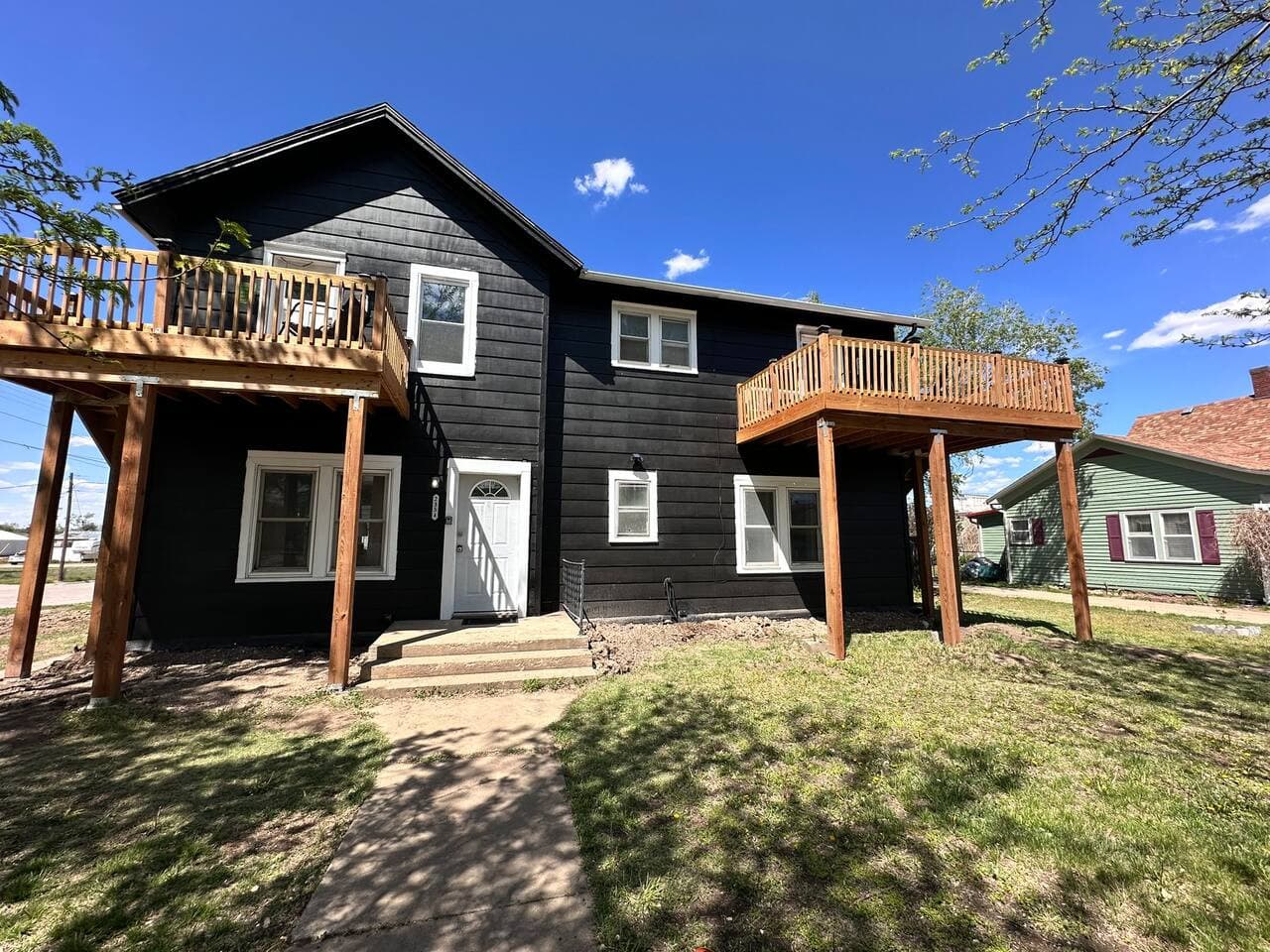 Relax at this beautiful black farmhouse-style Airbnb with large decks and a private yard, ideal for family trips, friend getaways, and weekend escapes close to dining, shopping, and local attractions.