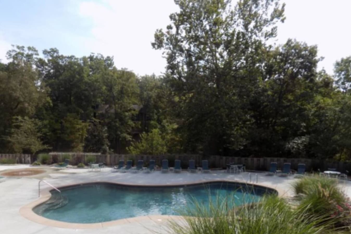 Relax by a peaceful outdoor pool surrounded by nature—perfect for quiet mornings and sunny afternoons.