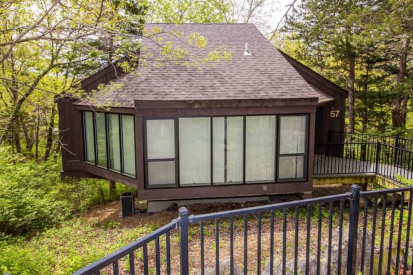 Explore the inviting exterior of Treetop Villa 57, a beautiful and distinctive part of the Treetop Village community.