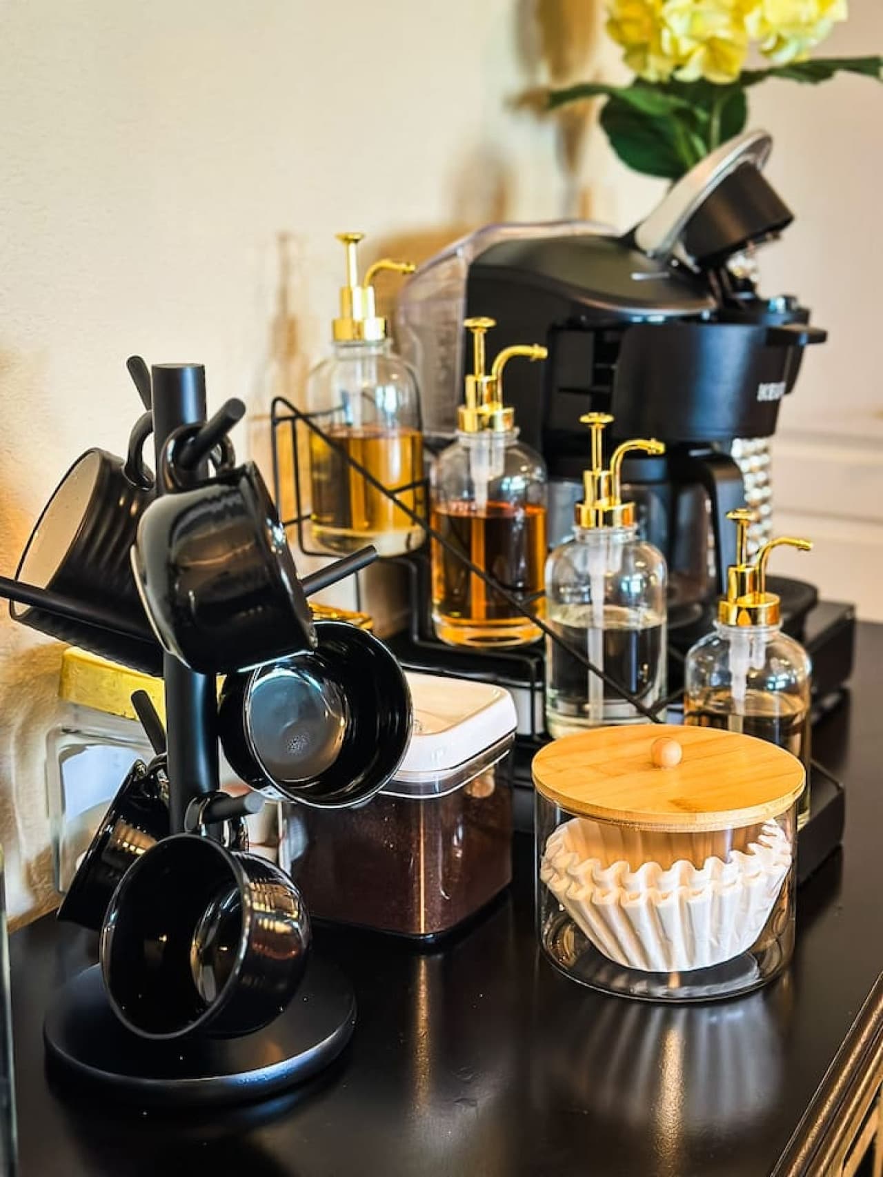 This fully stocked coffee bar features a Keurig machine, mugs, and an assortment of coffee accessories, ensuring a perfect start to your day. Enjoy complimentary coffee and tea options, adding a convenient touch to your stay.